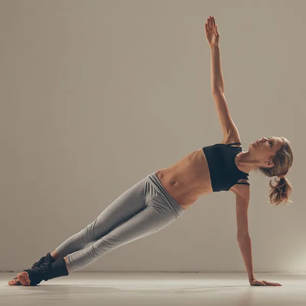 Young Woman Doing Yoga Indoors