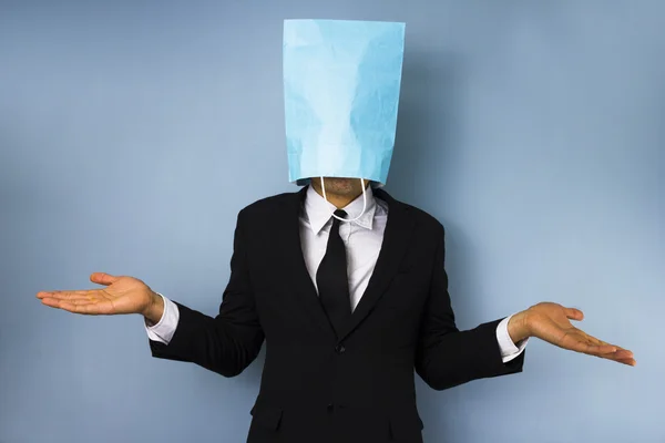 Businessman with bag over his head