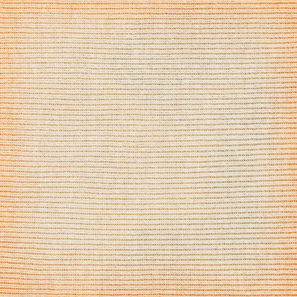 Light yellow knitted fabric texture or background.
