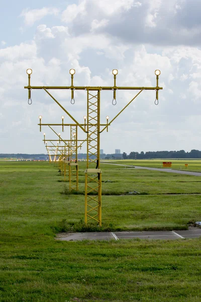 Cloudscape at airport between the runway lights