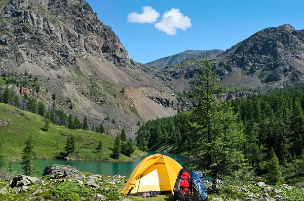 The camping tent near a mountain lake