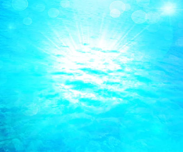 An image of a beautiful blue sea and sun background