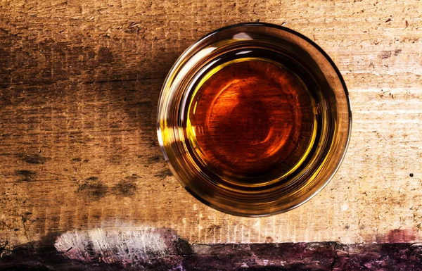 Scotch whiskey on wooden background