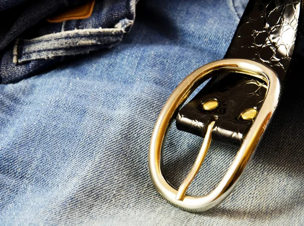 Belt and blue jeans.