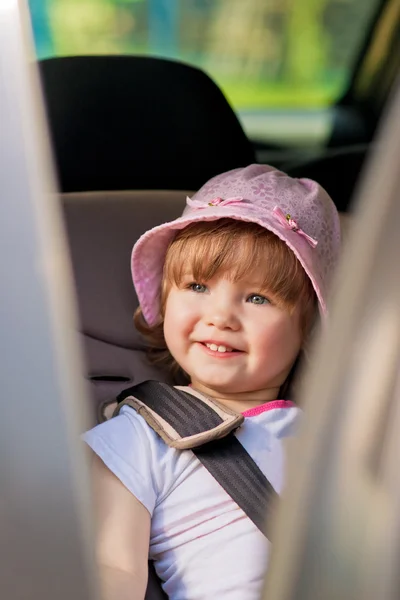 Baby girl in car safety seat