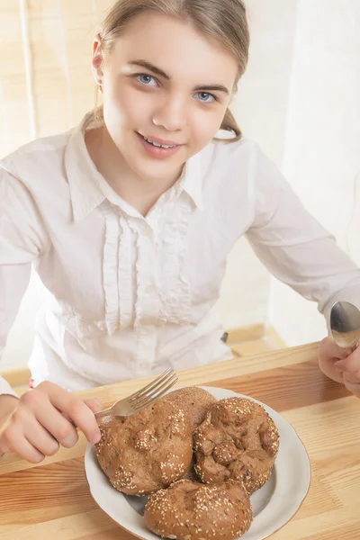 Portrait of happy Teenage Girl Preparing to Eat Breakfast.
