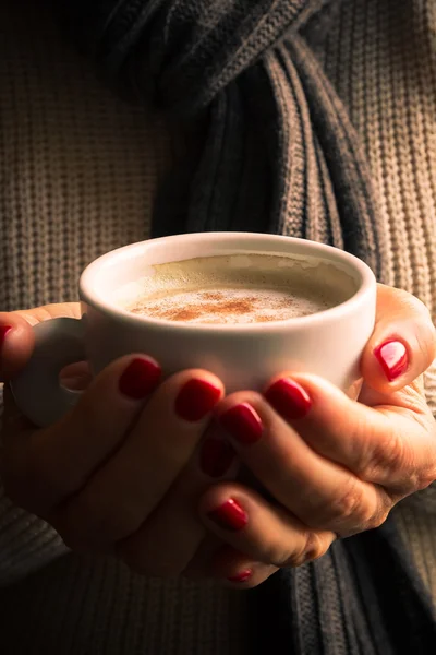 Female hands with coffee drink