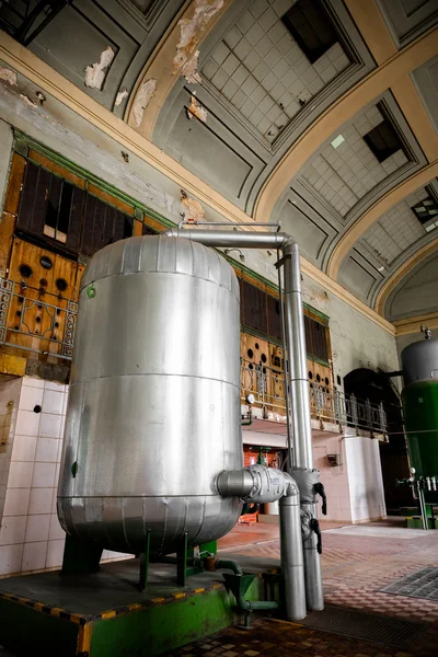 Old industrial building with a green metal container