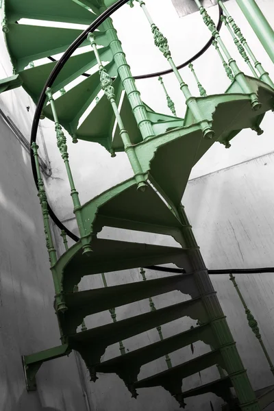 Old metal spiral stair in a factory