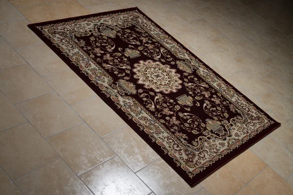 Persian Rug Isolated On Tiles