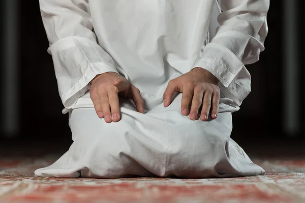 Close-Up Of Male Hands Praying In Mosque