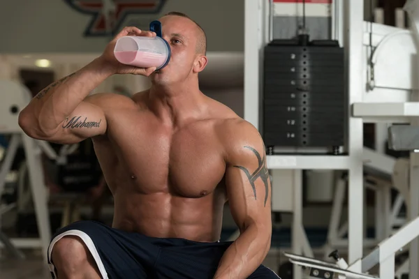 Bodybuilder With Protein Shaker