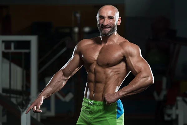Mature Muscular Man Flexing Muscles