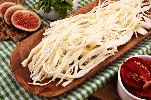 String Cheese On Chopping Board