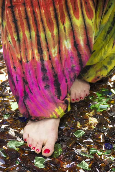 Female feet walking on broken , sharp glass, meditation