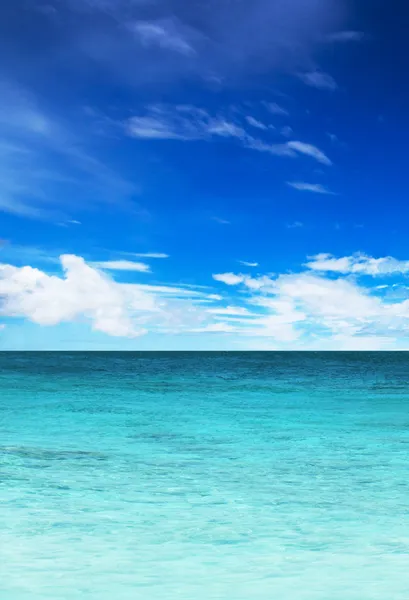 Turquoise water of the ocean and blue sky