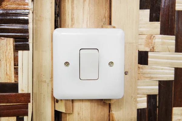Modern electrical switch of country hut.
