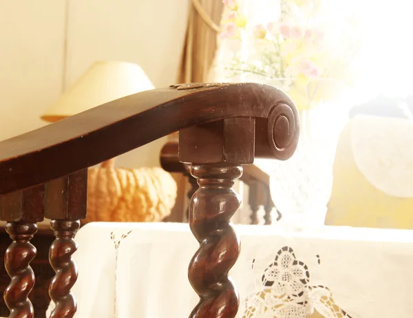 Detail of old brown wood furniture in the room with sunlight. Shallow depth of field