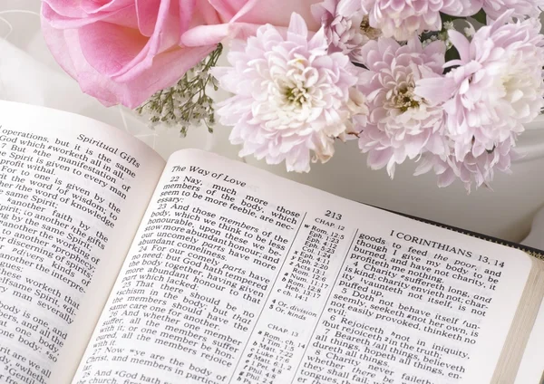 Holy Bible and flowers.