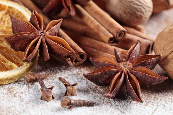 Cinnamon sticks, anise stars, nutmegs, cloves, nuts and vanilla beans