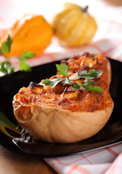 Butternut squash stuffed with minced meat, couscous and cheese. — Stock Photo #28638099