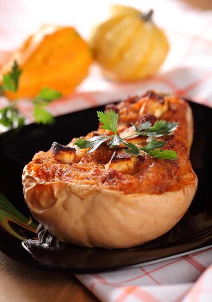 Butternut squash stuffed with minced meat, couscous and cheese.