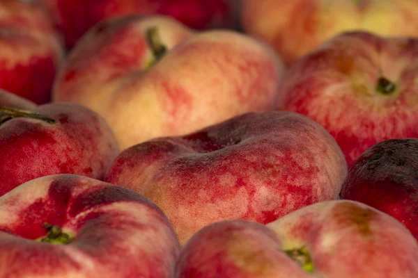 Background of red juicy peaches
