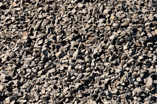 Different colors gravel background, rock pieces texture, natural background, stones texture, granite. Contrast photo. Material. Ground.