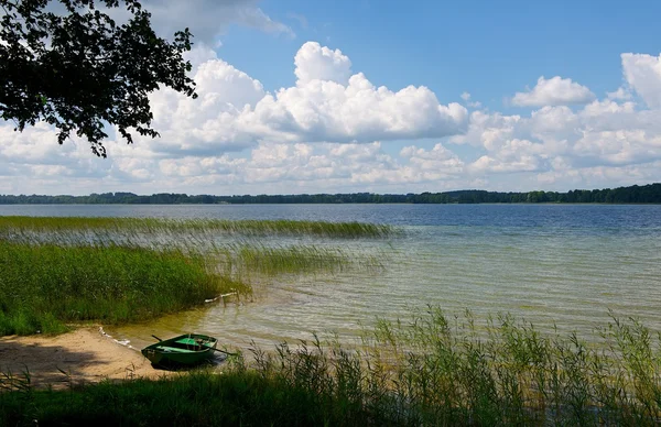 Lithuanian landscape on sunny summer day, summer, camping area in sunny day , camping and relaxing area, Lithuania, one canoe near like, summer activities, sport
