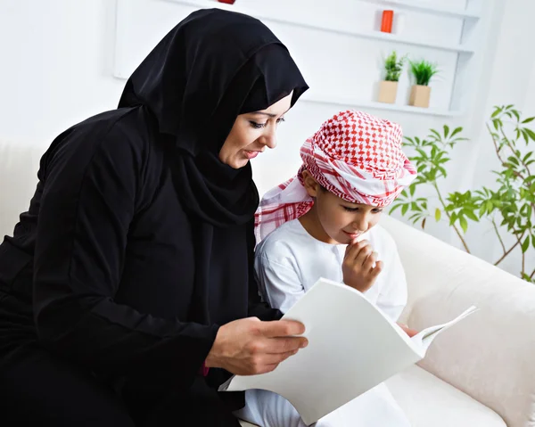 Arabic mother and son on couch