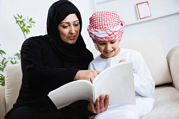 Arabic mother and son on couch