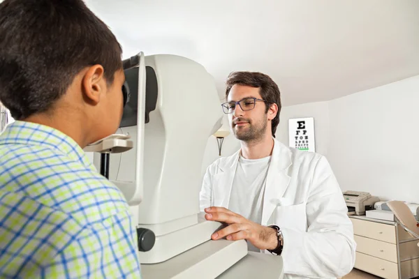 Ophthalmologist With Little Boy