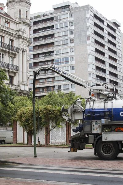 A truck cleaning the streets with water pressure
