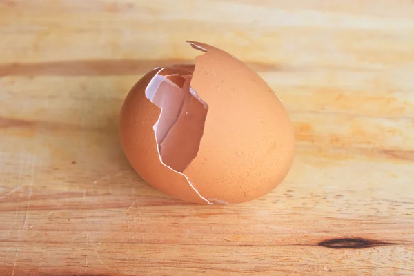 Broken eggs on cutting board