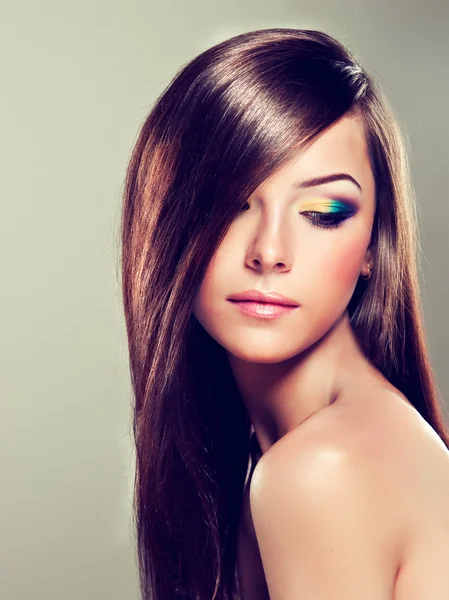 Brunette with long hair and modern make-up