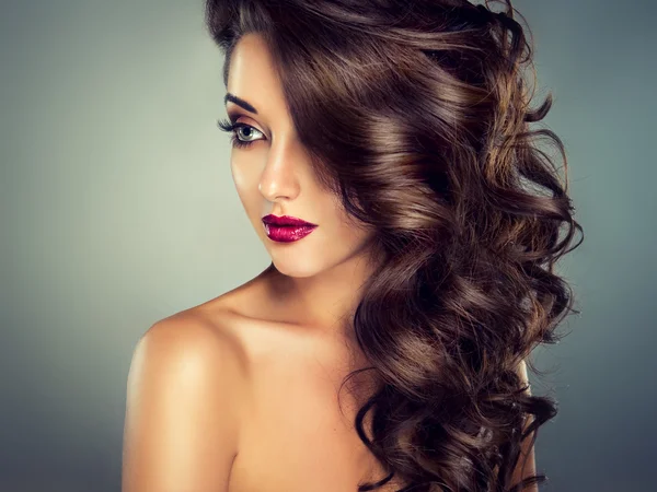 Sensual brunette woman with curly hair