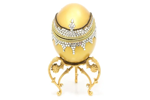 Close up handmade golden egg wedding ring box