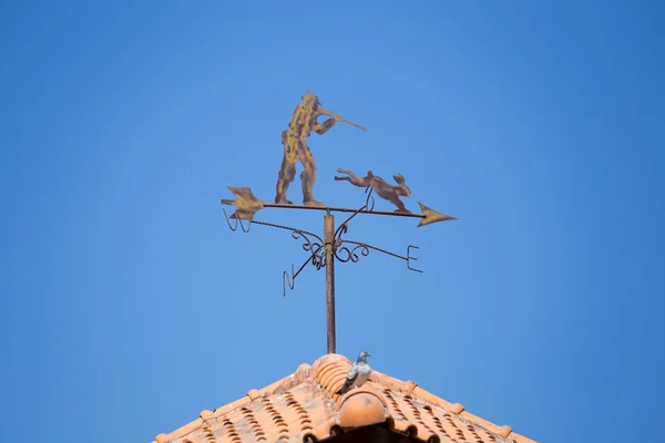 Weathervane on a roof top showing wind direction