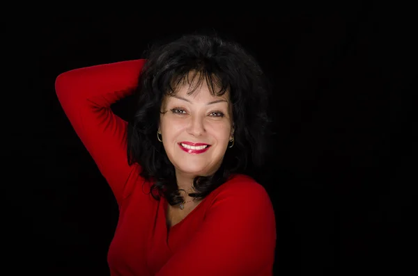 Smiling mature lady with black hair