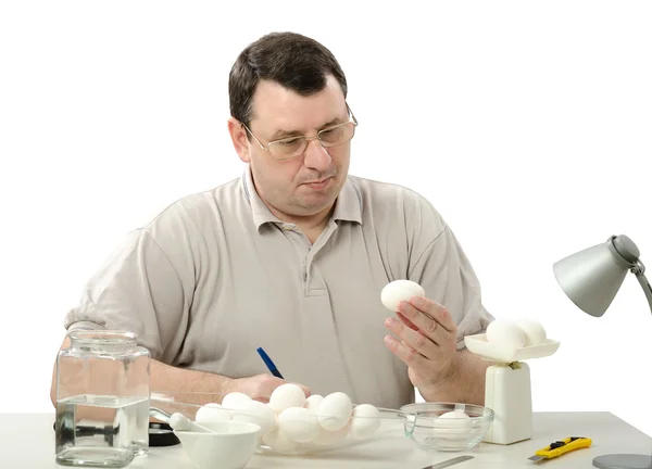 Phytocontrol engineer carefully analyzes eggs