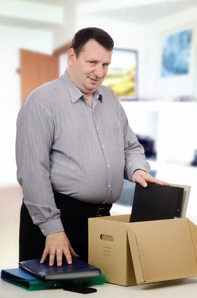 Overweight middle-aged man got a new job in the office