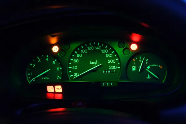 The Dashboard of a Car at Night