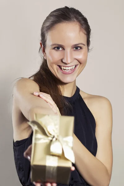 Smiling Girl Holding a Gift