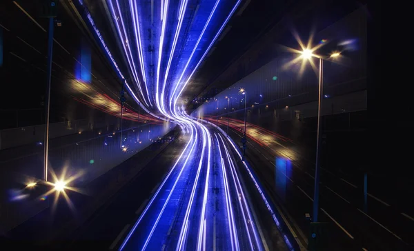 Light trail view at a busy highway