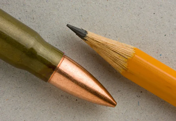 Macro of lead pencil and bullet