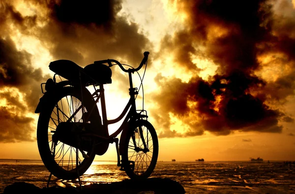 Sillhouette of bicycle at cloudy morning