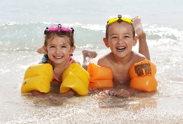 Children lying on the beach