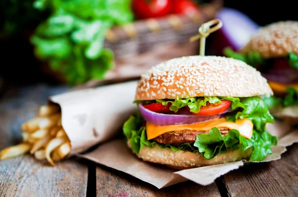 Closeup of home made burgers on wooden background