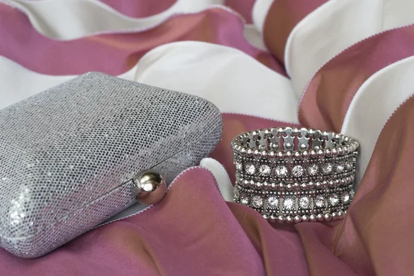 Clutch bag and bracelet of crystals