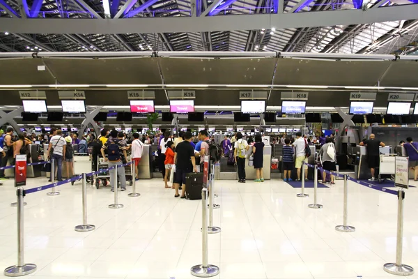 BANGKOK - AUGUST 15 : People waiting in check-in line K terminal